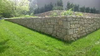 Multi-level retaining wall terracing a sloped yard